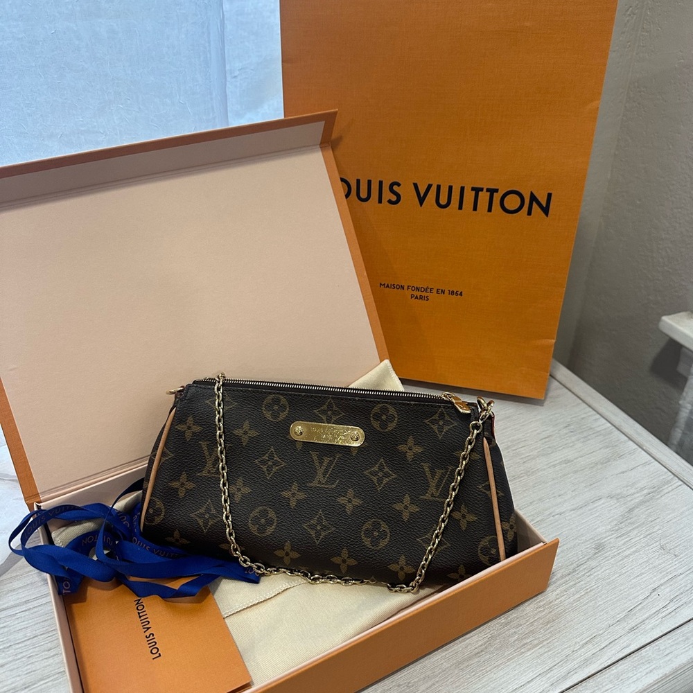 Louis Vuitton pochette Eva purse with all original packaging and receipt